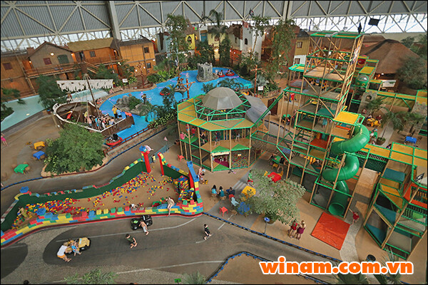 KRAUSNICK, GERMANY - FEBRUARY 15: Visitors explore the Tropino children's adventure park at the Tropical Islands indoor resort on February 15, 2013 in Krausnick, Germany. Located on the site of a former Soviet military air base, the resort occupies a hangar built originally to house airships designed to haul long-distance cargo. Tropical Islands opened to the public in 2004 and offers visitors a tropical getaway complete with exotic flora and fauna, a beach, lagoon, restaurants, water slide, evening shows, sauna, adventure park and overnights stays ranging from rudimentary to luxury. The hangar, which is 360 metres long, 210 metres wide and 107 metres high, is tall enough to enclose the Statue of Liberty. (Photo by Sean Gallup/Getty Images)